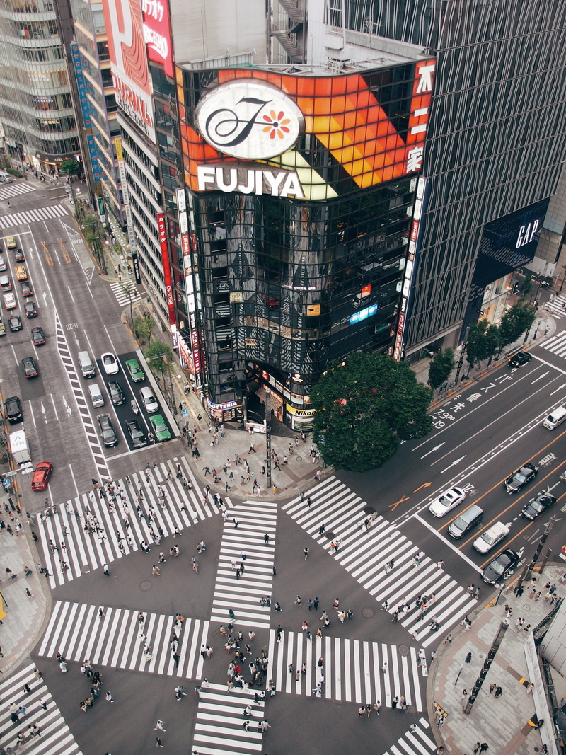 outdoors, motor vehicle, incidental people, crossing, city, building, road, zebra crossing, japan, transportation, city life, built structure, car, sign
