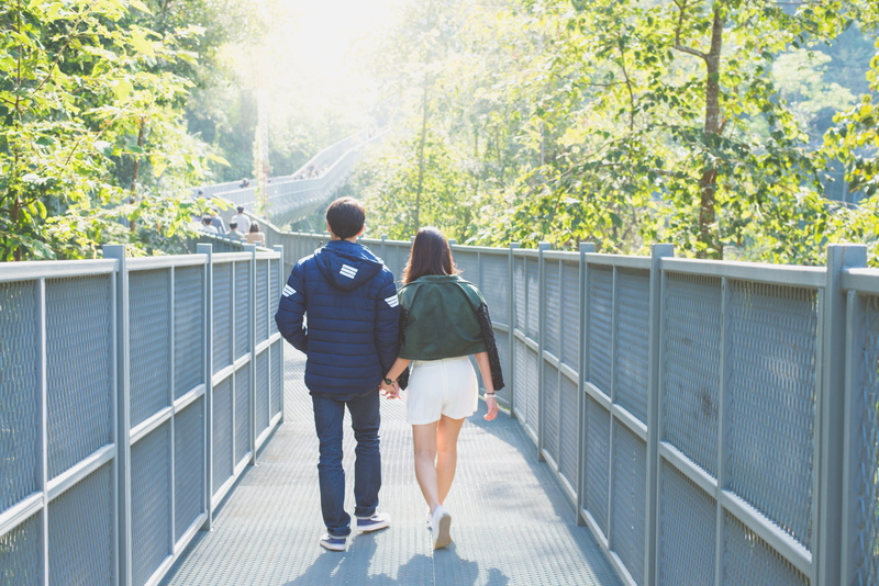 leaves, mountain, vacation, tourism, sun glare, casual clothing, nature, full length, built structure, togetherness, standing, love, two people, fence