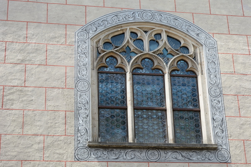 old window, pattern, wall - building feature, glass, ornate, creativity, leaded glass, arch, design, historicized, brick, belief, day, low angle view, old