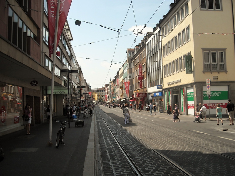 transportation, direction, outdoors, women, road, group of people, mode of transportation, track, railroad track, architecture, building, street, city street