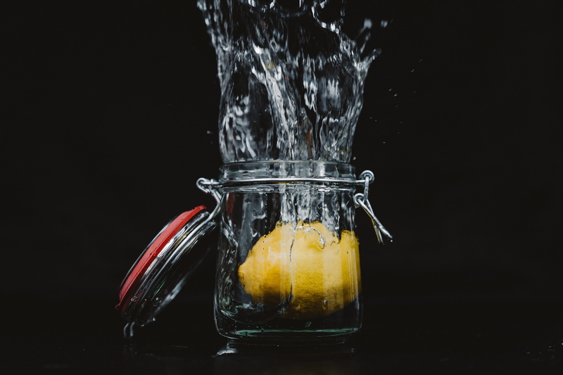 no people, ginger, clear, glass, splashing, black background, powder, beverage, container, still life, transparent, stein, lime, drink, lemon, alcohol