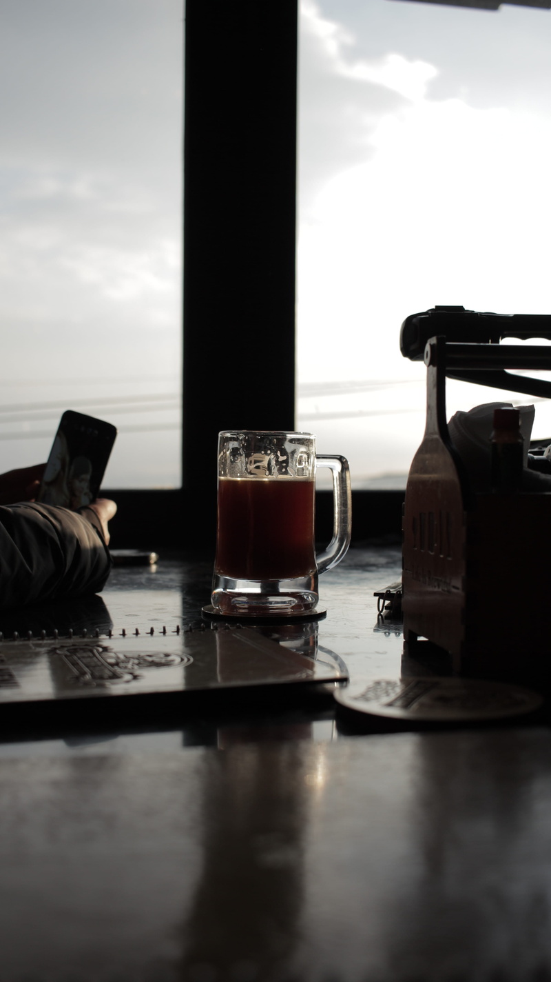 lager, drink, indoors, brew, sitting, desk, household equipment, drinking glass, still life, computer, beer glass, day, pc, pub, container, beverage, building