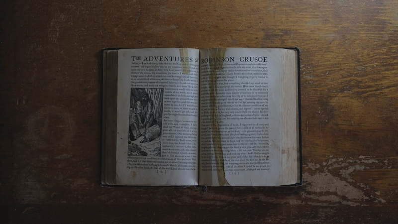 religion, indoors, wood, communication, paper, page, adventures, still life, open, directly above, book, robinsoncrusoe, high angle view, 2K, table, close-up