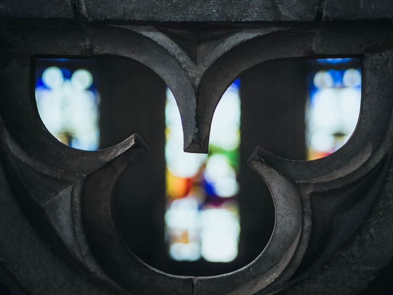 shapes, indoors, background, built structure, stained glass, cold, no people, focus on foreground, hd, car, mode of transportation, 50mm, wheel