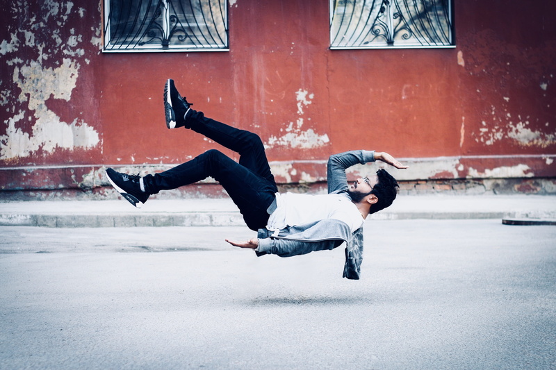 casual clothing, high, pants, skill, mid-air, two people, couple - relationship, ukraine, winter, wearing, men, portrait, human arm, balance, jumping, city