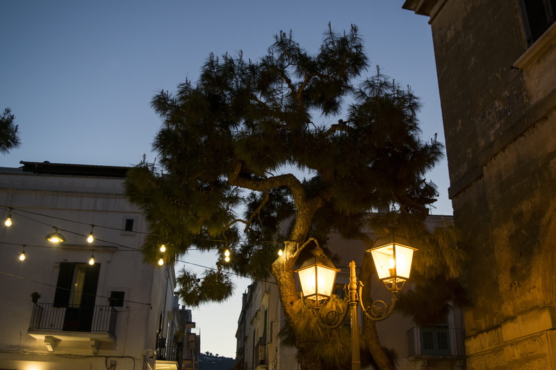 lamp post, walkway, street, old, tower, illuminated, sky, flare, city, nature, night, flagstone, low angle view, dusk, town, built structure, belief, path