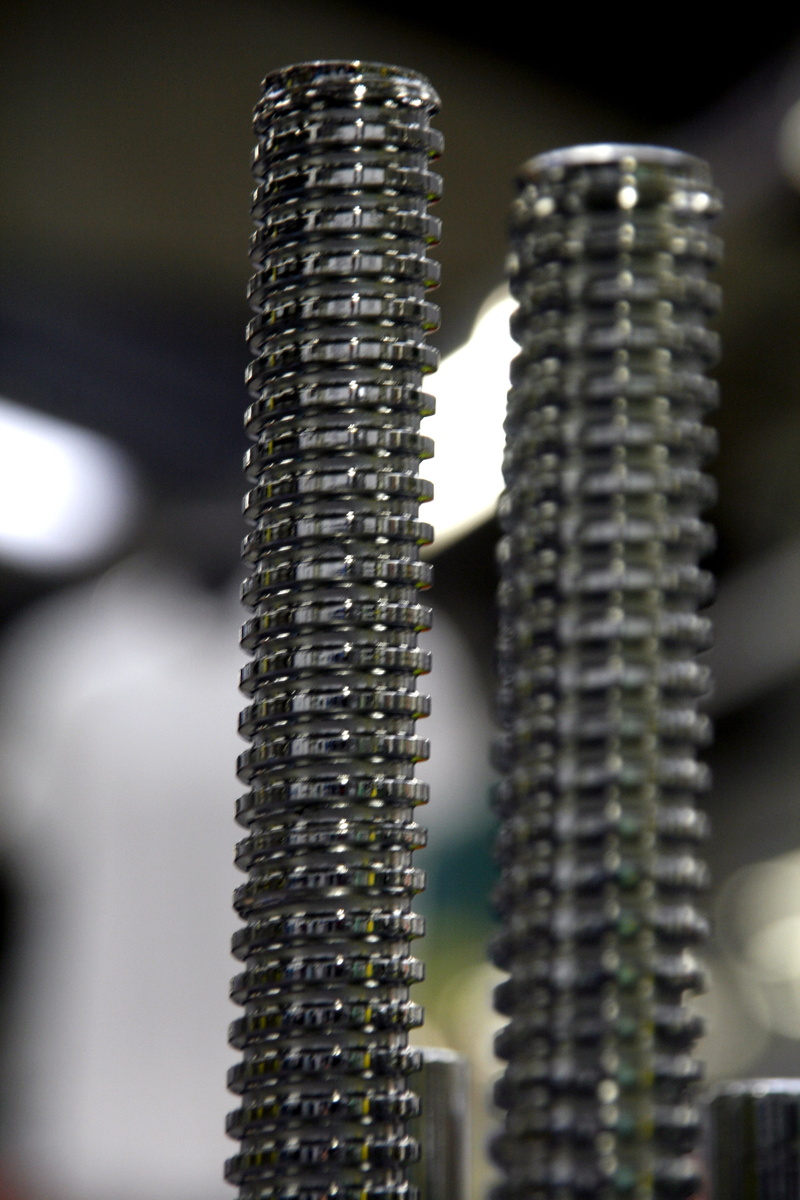 single object, bolt, focus on foreground, gear, tool, nut, pattern, texture, no people, hardware, day, industrial, steel, still life, selective focus, 4K