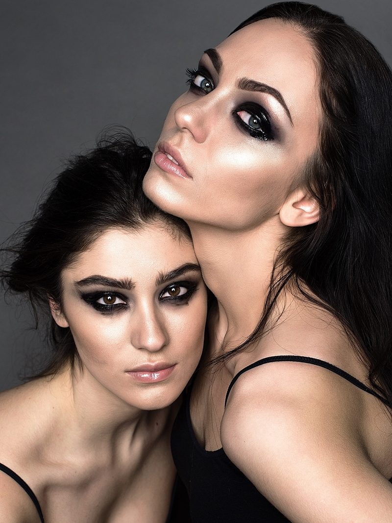 looking at camera, indoors, glamour, body part, young adult, people, tops, two, eyeshadow, dark, make-up, fashion, adult, wearing, hairstyle, makeup, togetherness