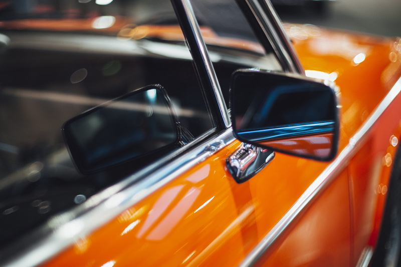 traffic, wheel, vehicle, orange, automobile, symbol, vehicle mirror, car, taxi, orange color, city, glass - material, chromed, motion, electronics, trademark