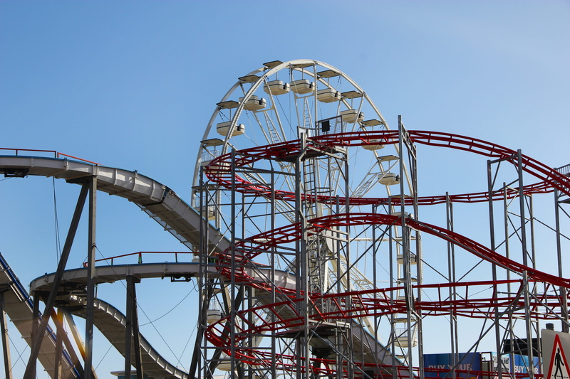 pleasure, carnival, ferris wheel, metal, enjoyment, excitement, outdoors, no people, day, amusement, rollercoaster, low angle view, architecture, roller coaster