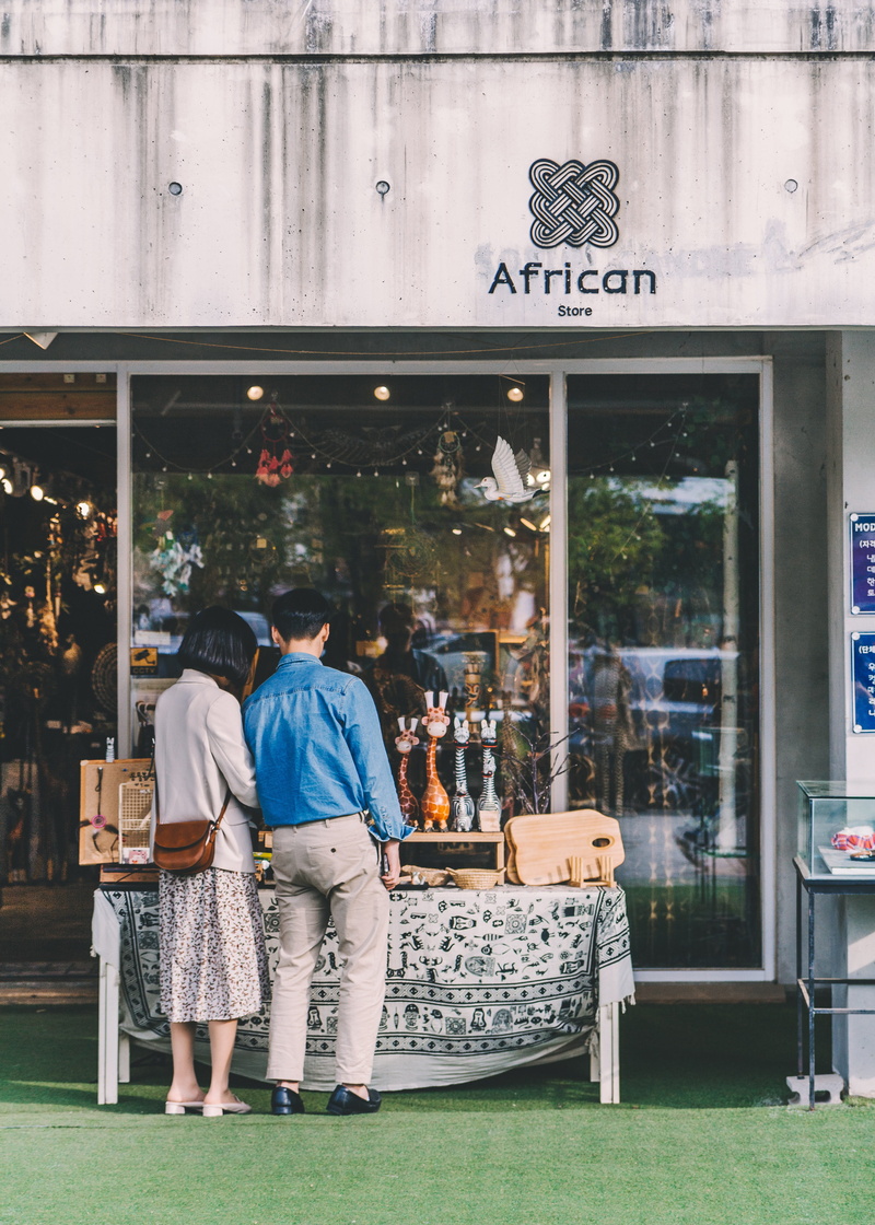 building exterior, built structure, full length, adult, day, standing, shoe, door, men, bakery, couple - relationship, architecture, sleeve, lifestyles
