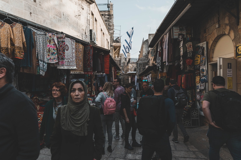 lifestyles, building exterior, street, walking, clothing, group of people, warm clothing, market, store, pedestrian, street photography, footwear, built structure