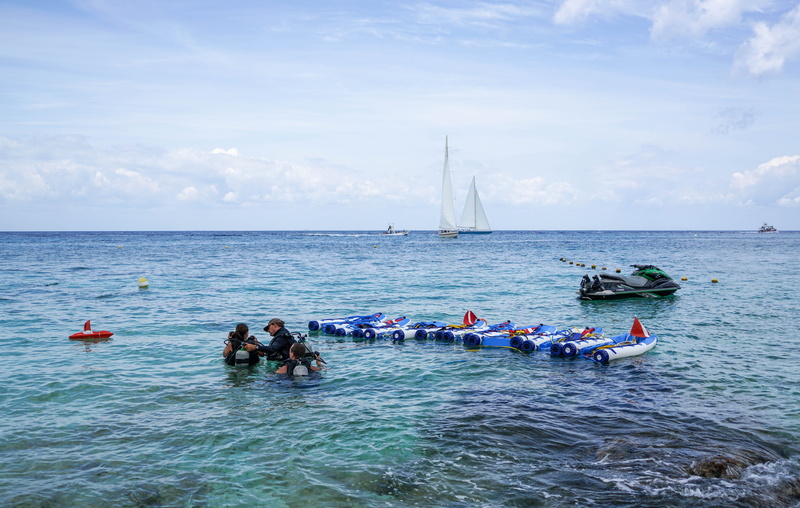people, summer, men, 5K, caribbean, tourism, beach, waterfront, group of people, large group of people, lifestyles, outdoors, nature landscape, mode of transportation