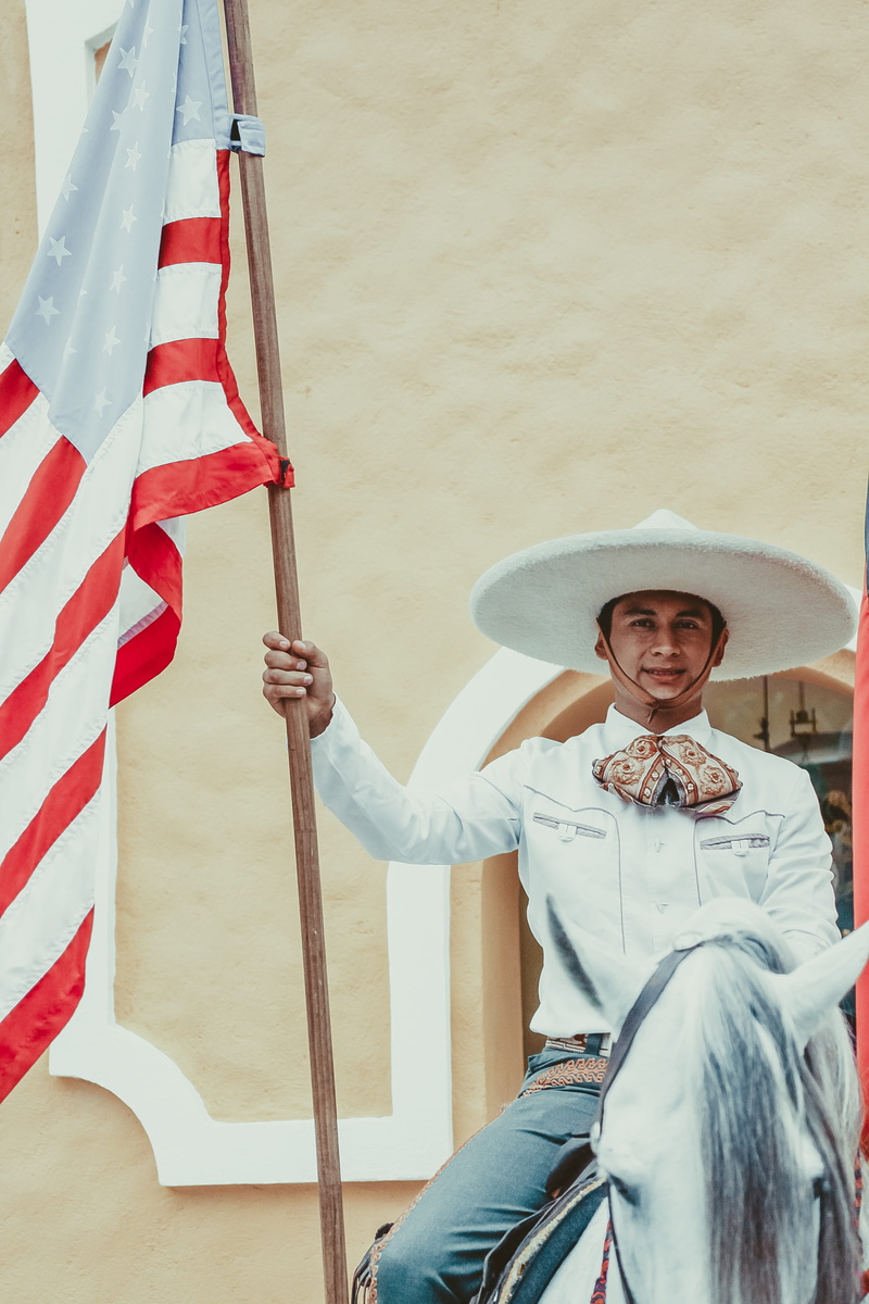 sombrero, leisure activity, somebody, men, clothing, happiness, uniform, tradition, lifestyles, casual clothing, american flag, horse, three quarter length