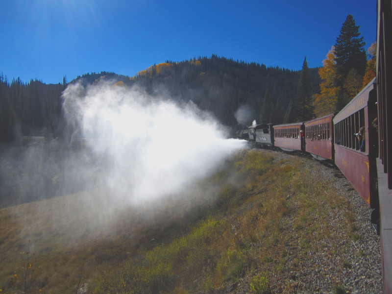 scenics - nature, train - vehicle, locomotive, land, non-urban scene, environment, smoke, steam engine, rail transportation, sky, no people, tree, public transportation