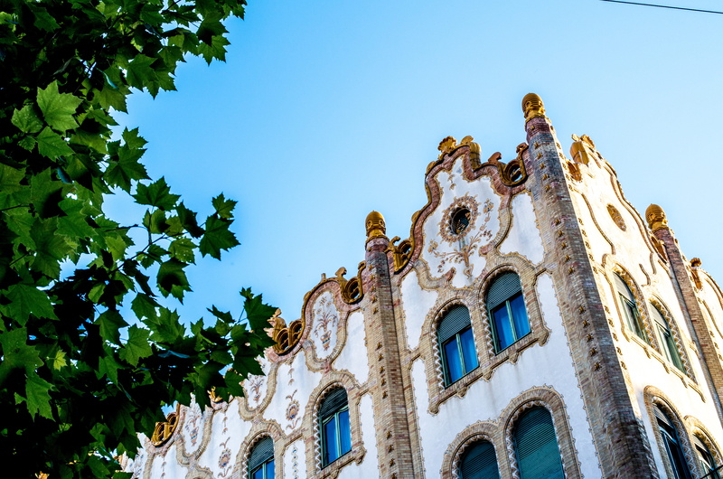 sunlight, clear sky, travel destinations, architecture, low angle view, nature, no people, budapest, building, window, day, arch, tree, history, hungarian state treasury