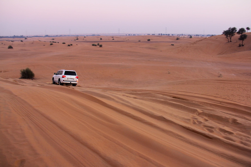 middle east, 2K, sand, dry, sky, outdoors, land vehicle, mode of transportation, desert, on the move, sports utility vehicle, non-urban scene, dubai uae