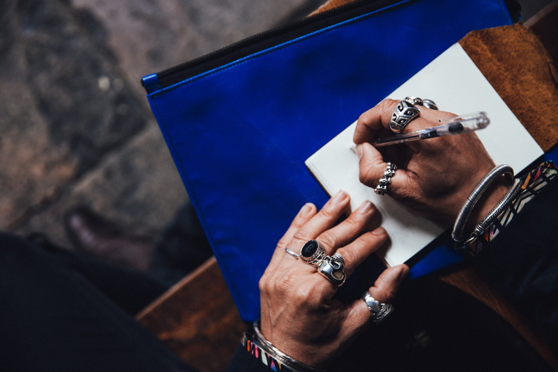 table, document, rings, technology, hands, caucasian, time, wearing, ideas, thumb rings, holding, pen, jewelry, paper, lifestyles, human, sitting, bracelets