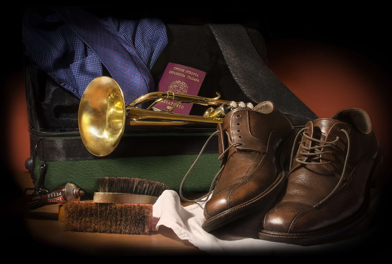 italian, arts culture and entertainment, menswear, shoe, wood - material, leather, table, elegance, musician, brass, personal accessory, man, paper, bag