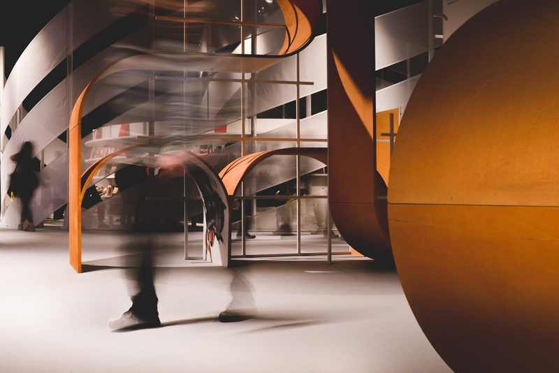 motion, leisure activity, frankfurt, young adult, travel, flooring, indoors, blurred motion, book fair, architecture, lighting, staircase, adult, glass - material