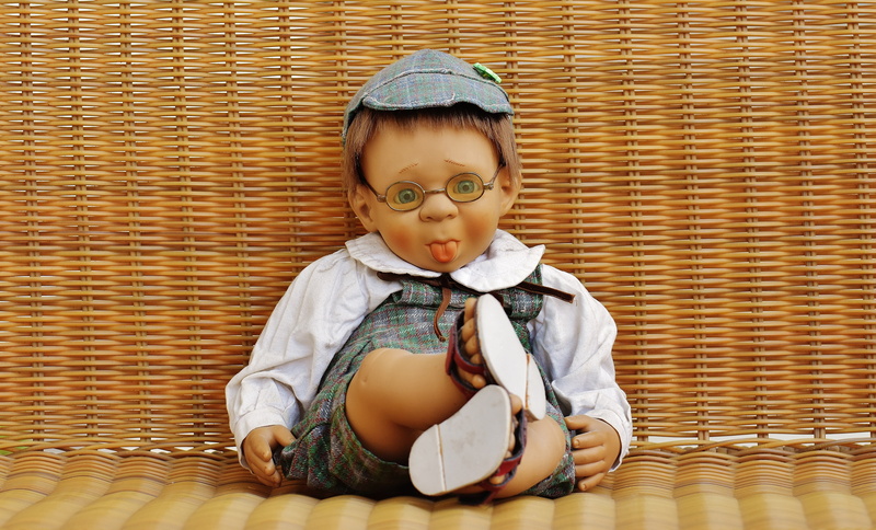 eyeglasses, doll, indoors, wearing, males, toys, 5K, funny, boy, children, cheeky, sitting, top, real people, gray, childhood, child, front view, men