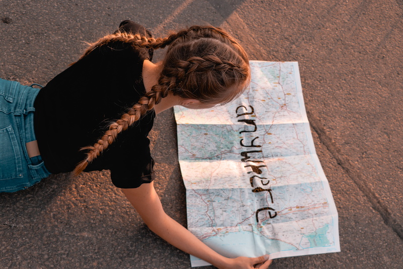 street map, casual clothing, real people, woman, brown hair, road, blond, hair, travel, lifestyles, map, one person, human hair, adult, young women, long hair