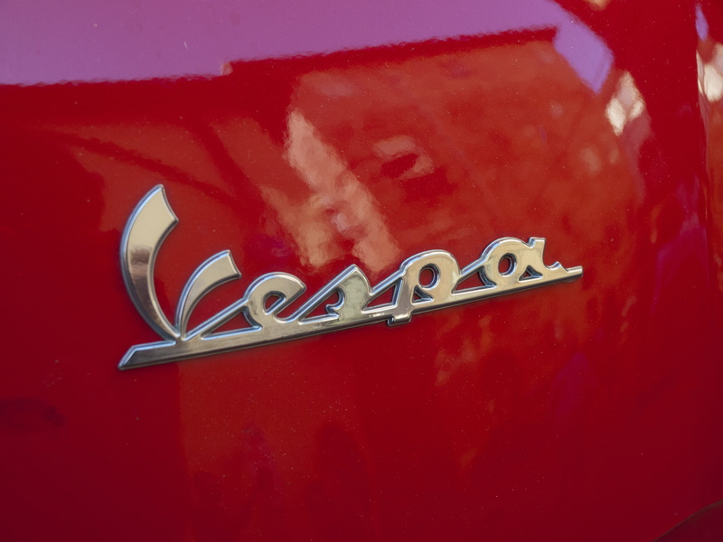 logo, still life, close-up, creativity, capital letter, single word, cult, metal, silver colored, 2K, letter, motor scooter, vespa, city, lettering, italy
