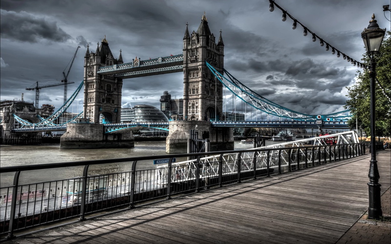 bridge - man made structure, symbol, built structure, river, water, tower, connection, city, bridge, tourism, outdoors, cloud - sky, e, engineering, architecture