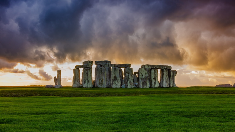 dramatic sky, storm, history, nature, landscape, ruined, environment, beauty in nature, sunset, cloud - sky, sky, built structure, land, field, stonehenge