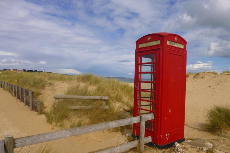 landscape, communication, barrier, south gland, telephone booth, outdoors, sand, technology, red, nature, connection, telephone, beach phone, sky, no people
