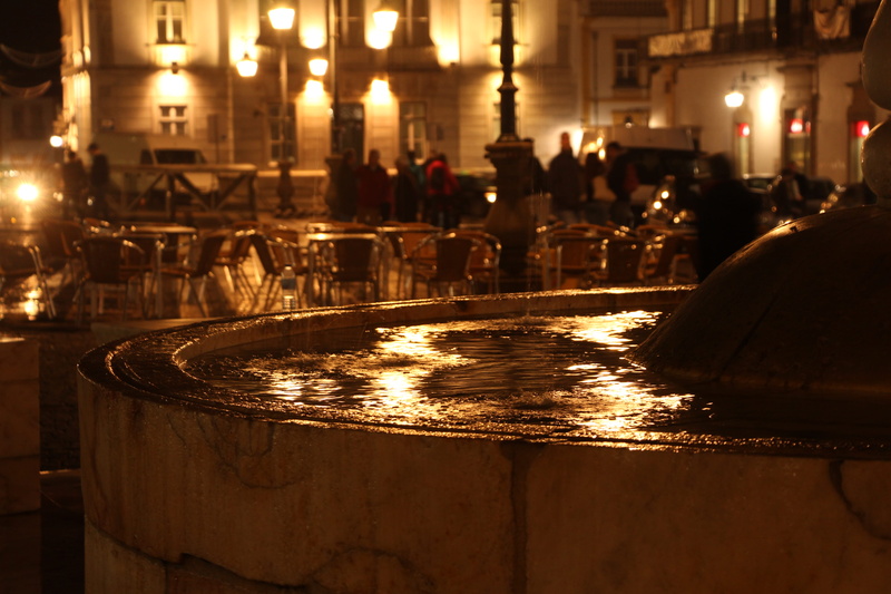 water, wet, illuminated, real people, glowing, reflection, architecture, lighting equipment, city, évora, incidental people, street, nature, night, focus on foreground