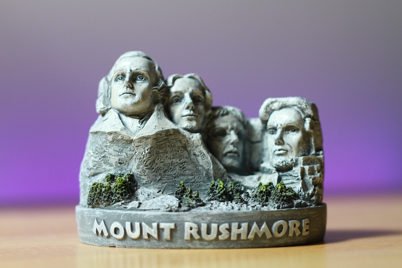 nature, sculpture, craft, male likeness, mammal, mount rushmore, 5K, close, rushmore, no people, photo, text, colored background, figurine, human representation