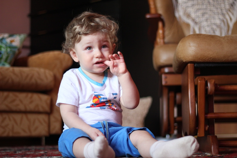 males, child, hairstyle, front view, 5K, contemplation, furniture, living room, baby, bobblehead, portrait, childhood, innocence, one person, hair, sofa