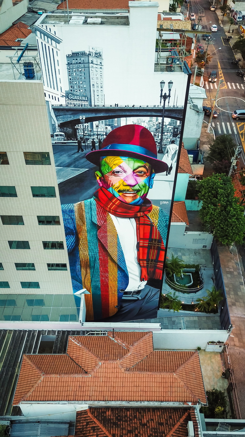 statue, multi colored, building, no people, glass - material, representation, built structure, graffiti, wearing, high rise, plaid, red, sculpture, art and craft