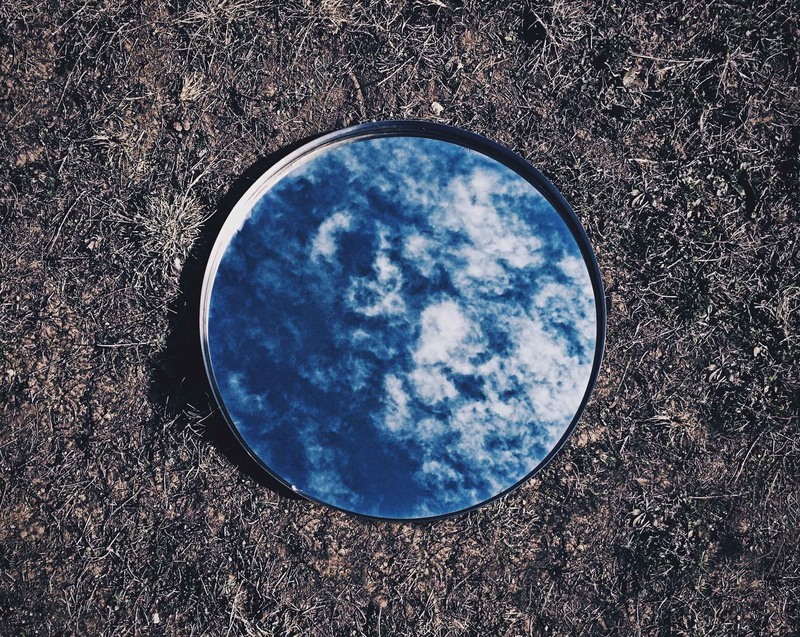 day, directly above, close-up, grass, mirror, blue, outdoors, sky, sunlight, high angle view, ground, nature, round, single object, design, cloud - sky