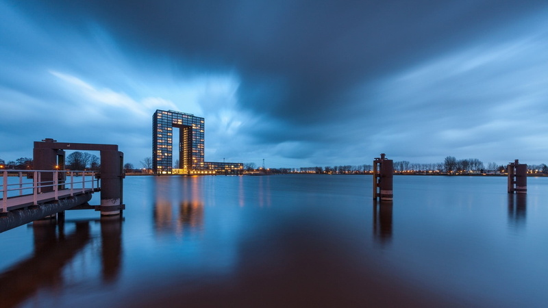bridge, near, office building exterior, body, building, dusk, reflection, illuminated, water, outdoors, building exterior, built structure, cityscape, cloud - sky