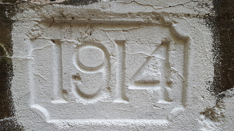 communication, crumbling, western script, wall - building feature, outdoors, weathered, 1914, abandoned, damaged, craft, bridge, cement, creativity, art and craft