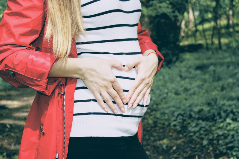 love, leisure activity, forming, forest, holing, one person, stripes, standing, women, heart, coat, tummy, daytime, hand, adult, couple - relationship