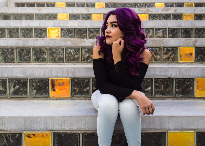 lifestyles, hair, real people, blocks, steps, front view, gray, glass, audi, waiting, daytime, looking away, women, stair, woman, young women, outdoors