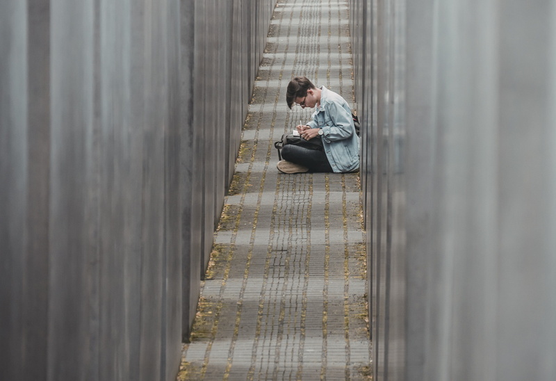 pathway, germany, jeans, boy, wall, writing, concrete, berlin, casual clothing, blue, architecture, glass, side view, young men, depression - sadness, one person