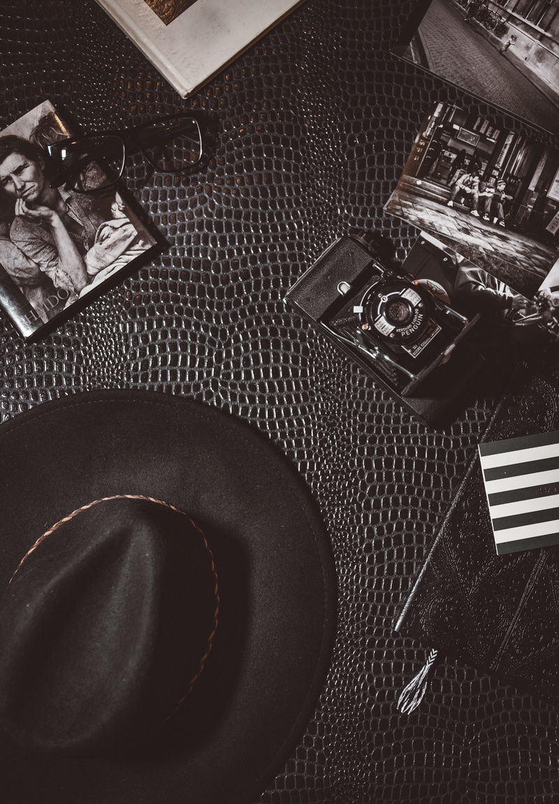 photography, leather, fashion, pen, close-up, indoors, photo, camera, no people, music, lens, hat, flat, 5K, eyeglasses, container, wallet, textile, directly above