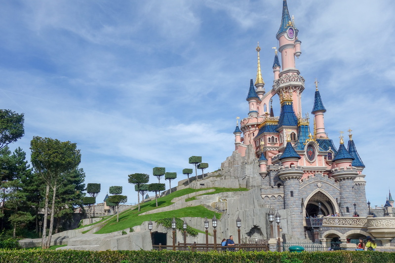 religion, day, disneyland, spire, low angle view, holiday, cloud - sky, nature, hobbies, history, tourism, place of worship, tower, leisure, city, travel