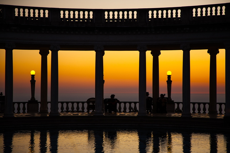 san simeon, bridge - man made structure, outdoors, men, sky, ocean, group of people, bridge, built structure, reflection, pool, castle, orange color, nature