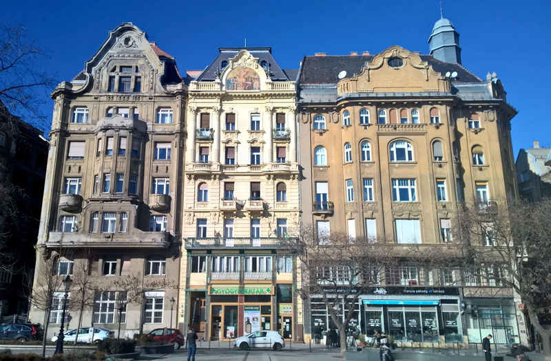 motor vehicle, low angle view, hungary, building exterior, clear sky, sky, mode of transportation, city, car, row house, budapest, architecture, window