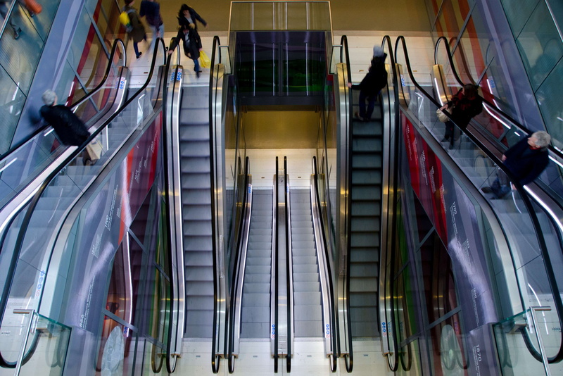 building exterior, car park, architecture, people, steps and staircases, shopping, mall, color, escalator, real people, building, going up, bags, errants