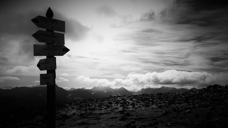 road, ominous, grayscale, mountain range, beauty in nature, outdoors, mountain, signpost, signage, sign, landscape, top, dramatic sky, black and white