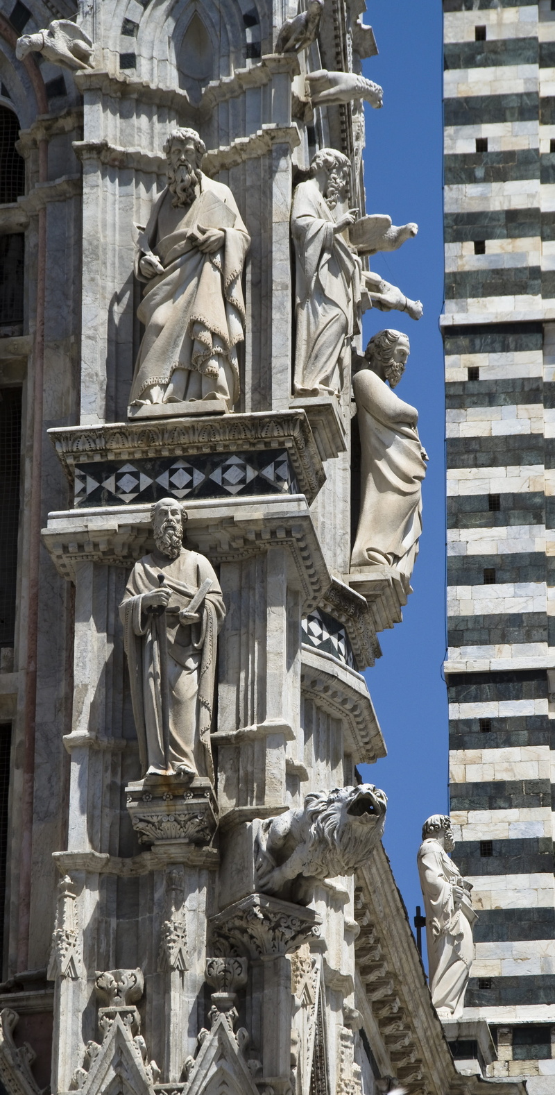 no people, creativity, building exterior, siena, low angle view, religion, architecture, sky, sculpture, facade, outdoors, statue, history, representation