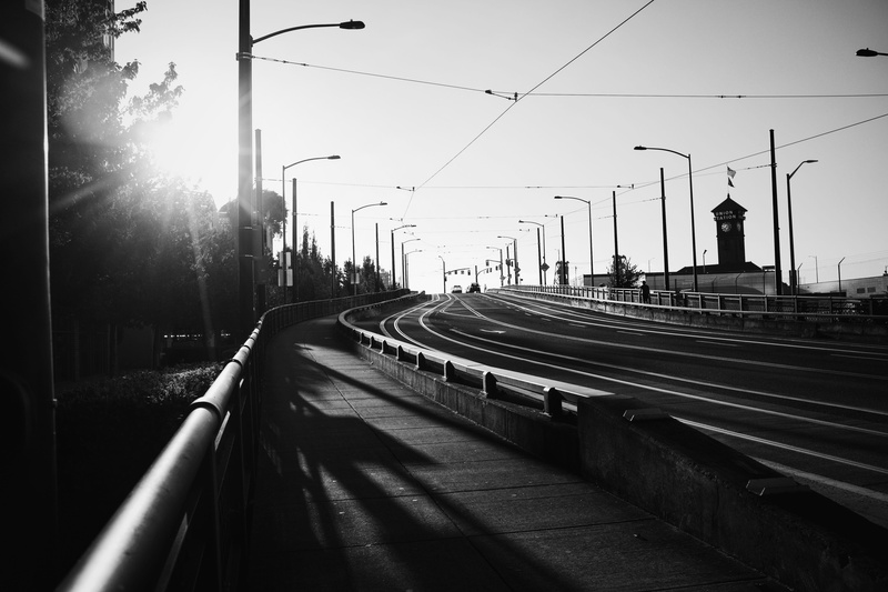 black, signs, architecture, sunlight, direction, building exterior, poles, portland, bridges, built structure, mode of transportation, railroad track, street light