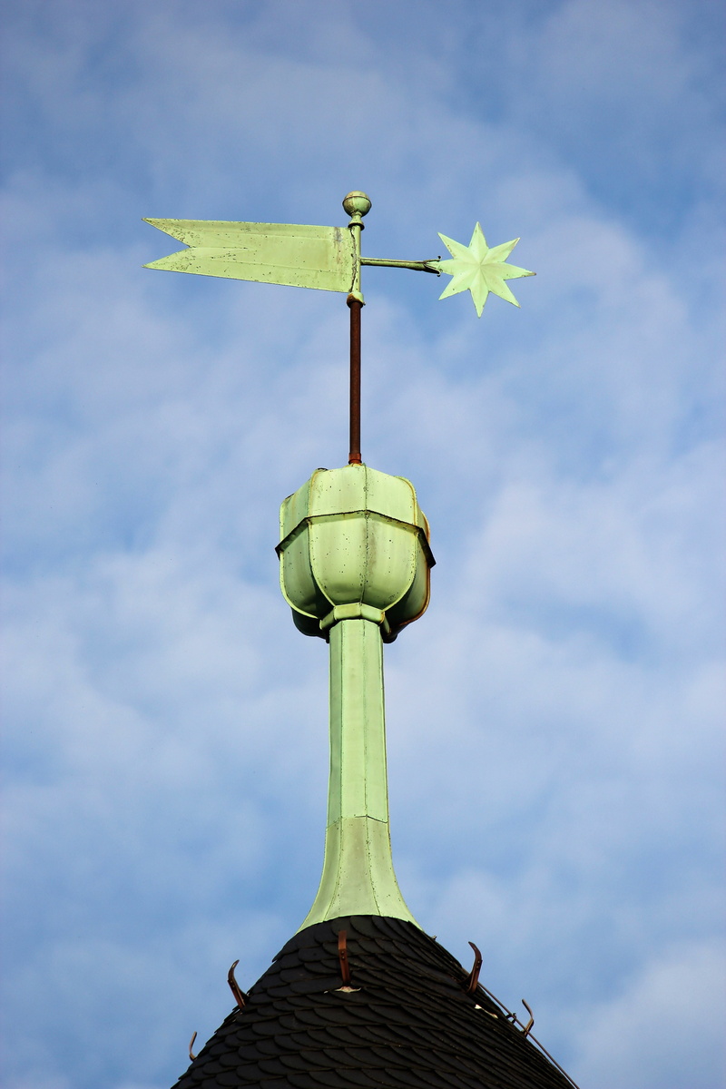 belief, building exterior, spirituality, cloud - sky, spire, low angle view, weather vane, outdoors, architecture, religion, green color, environmental conservation