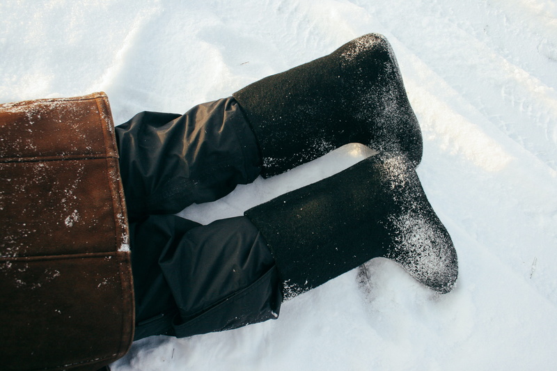 high angle view, winter, snowing, legs, real people, russian, white color, lying down, snow, black color, cold temperature, day, nature, adventure, lifestyles